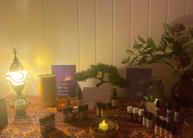 Aromatherapy oils on a table at The Massage Space, Winchester, England, GB, creating a calming atmosphere.
