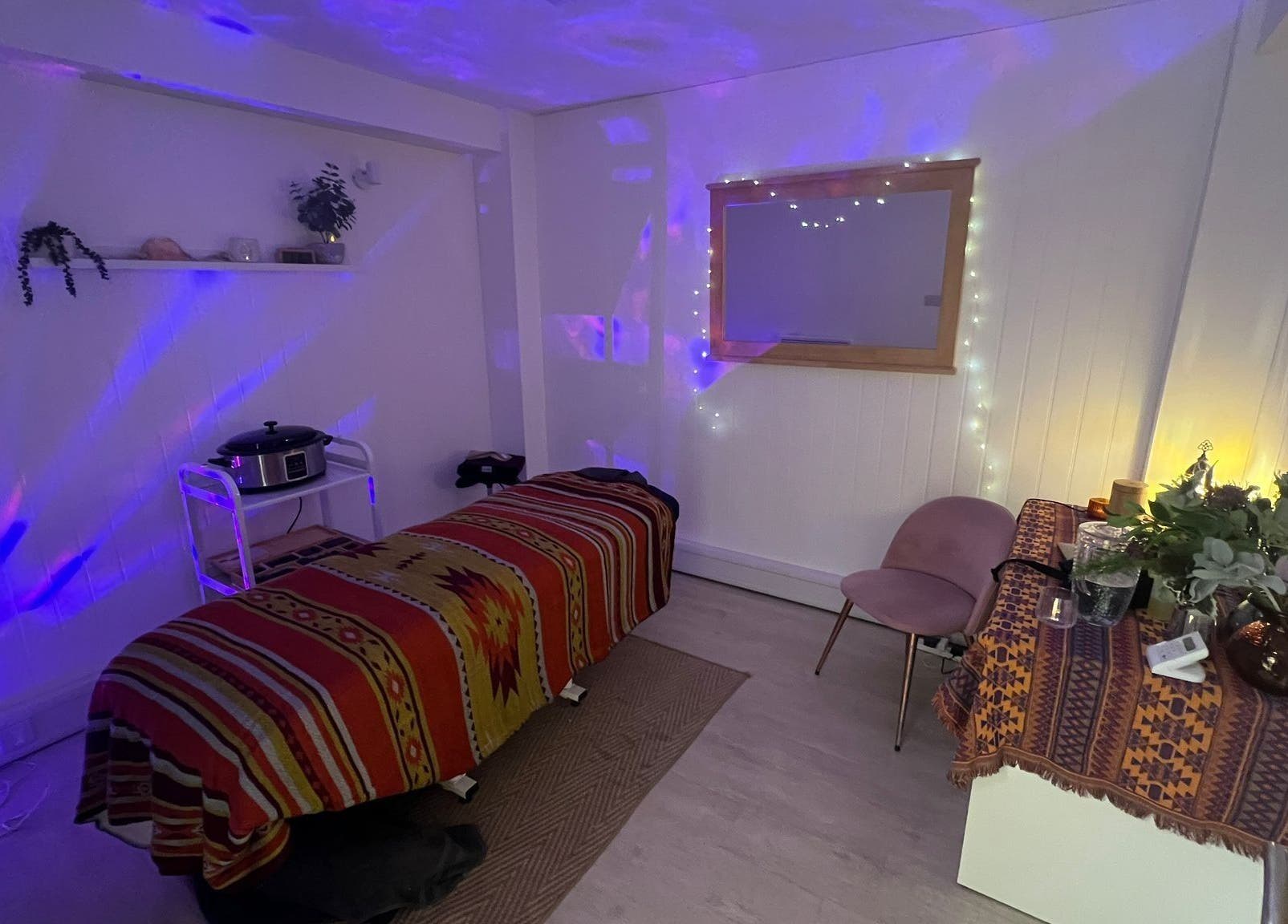 Relaxing massage room at The Massage Space in Winchester, England, GB with ambient lighting and decor.