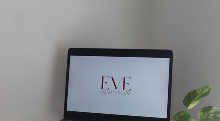 Eve Beauty Room logo on laptop at Tuggerah, New South Wales, AU with a green plant beside.