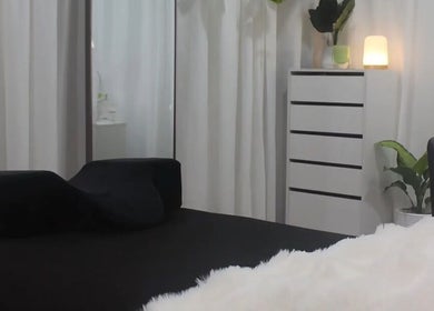 Elegant spa bed setup at Eve Beauty Room, Tuggerah, New South Wales, AU. Bright, serene atmosphere with lush plants.