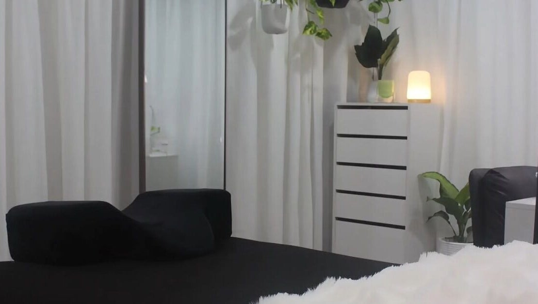 Relaxing treatment room at Eve Studio, Tuggerah, New South Wales, AU with plush decor and soothing light.