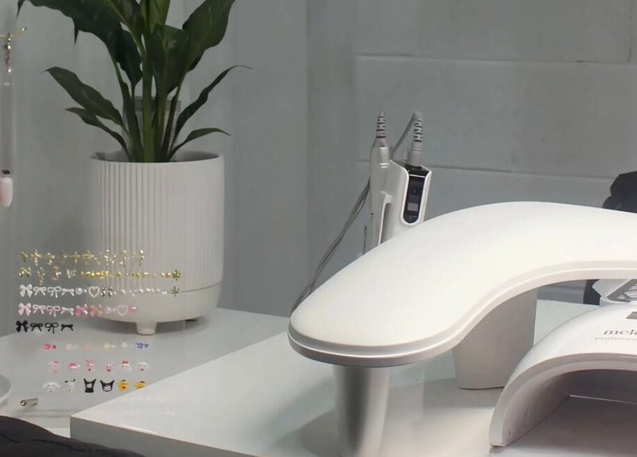 Eve Studio's chic nail station in Tuggerah, New South Wales, AU with nail art supplies and plant decor.