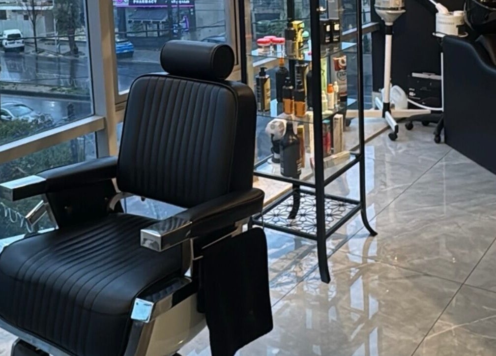 Luxurious barber chair inside The Dala, Amman, Amman Governorate, JO, showcasing style and comfort.