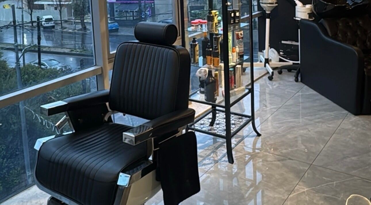 Luxurious barber chair inside The Dala, Amman, Amman Governorate, JO, showcasing style and comfort.