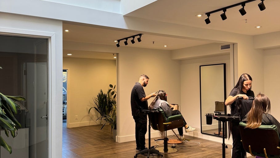 Stylists at Studio Choice working in a modern salon setting in Richmond Hill, Ontario, CA.