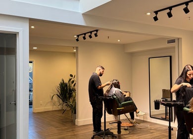Stylists at Studio Choice working in a modern salon setting in Richmond Hill, Ontario, CA.