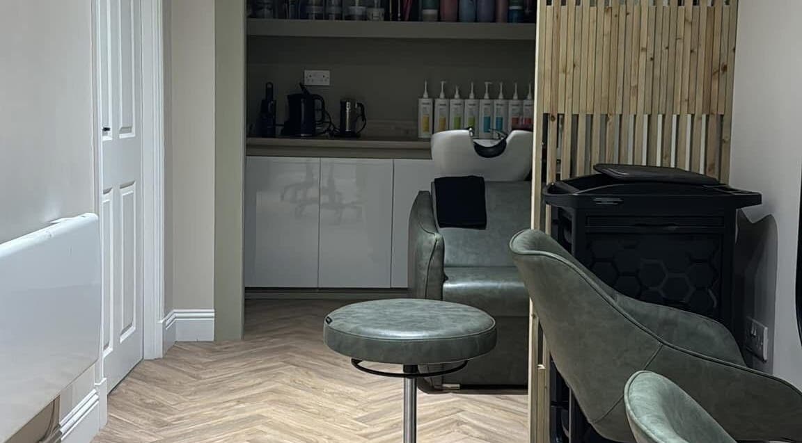 Chic interior of The Hair Spa in Cowdenbeath, Scotland, GB featuring stylish seating and modern decor.