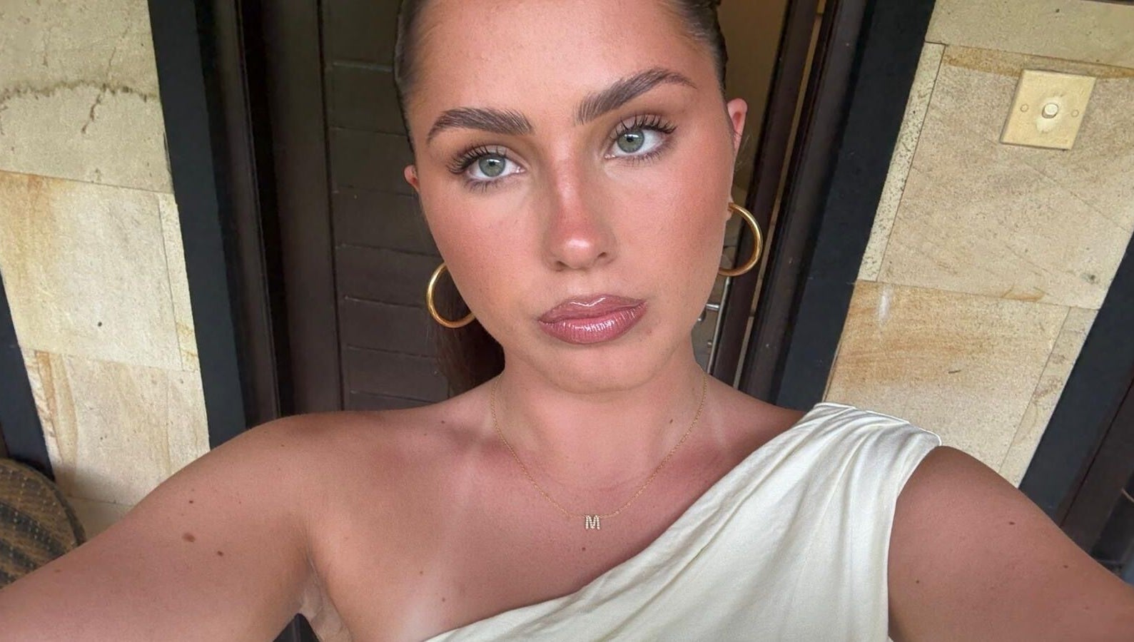 Portrait of a person in Casa La Belle, Biggera Waters, Queensland, AU, showcasing relaxed elegance.