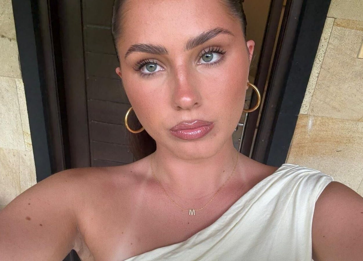 Portrait of a person in Casa La Belle, Biggera Waters, Queensland, AU, showcasing relaxed elegance.