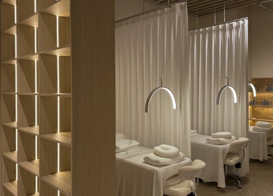 Tranquil spa treatment area at The Usual Lash in Darien, Connecticut, US with cozy reclining chairs and soft lighting.