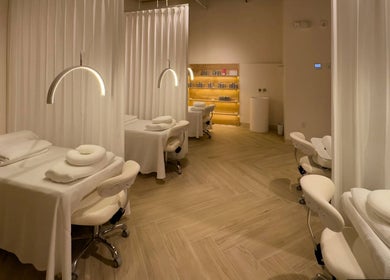 Elegantly designed treatment room at The Usual Lash in Darien, Connecticut, US, featuring cozy beds and soft lighting.