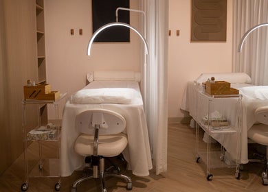 Modern treatment room at The Usual Lash, Darien, Connecticut, US with two spa beds and ambient lighting.
