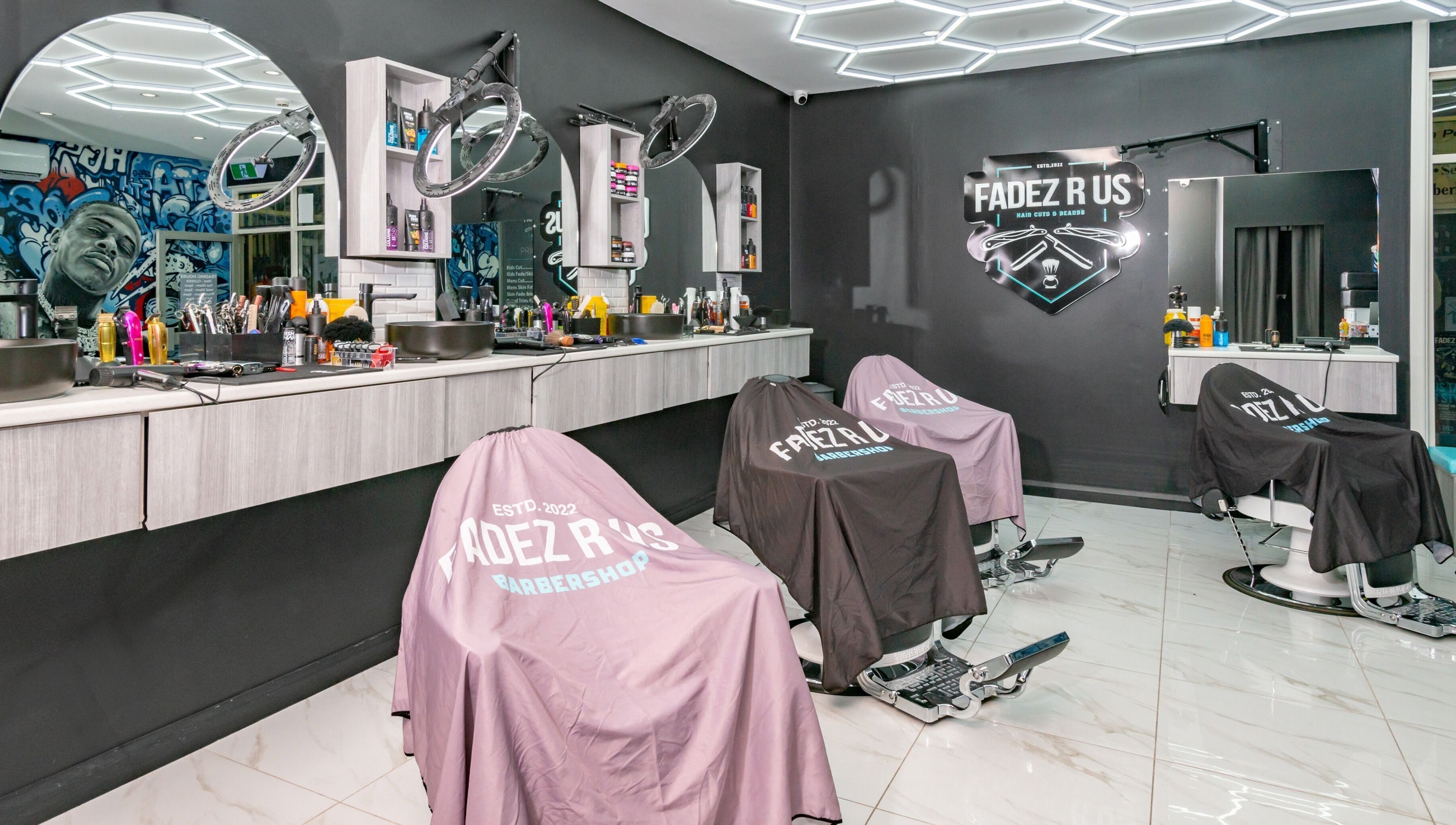 Modern barbershop interior at FADEZ R US, Penrith, NSW, AU, featuring sleek design and barber chairs.