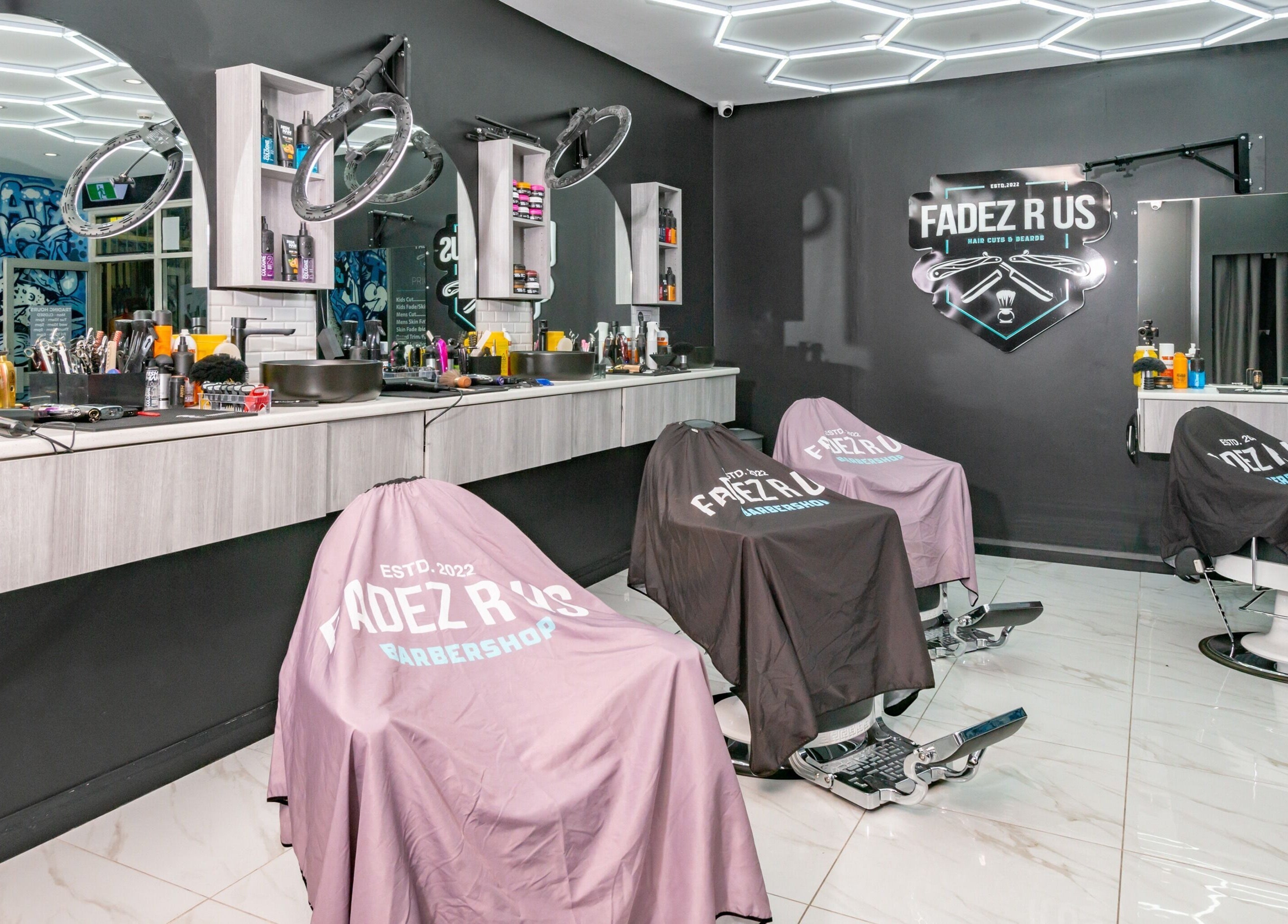 Modern barbershop interior at FADEZ R US, Penrith, NSW, AU, featuring sleek design and barber chairs.