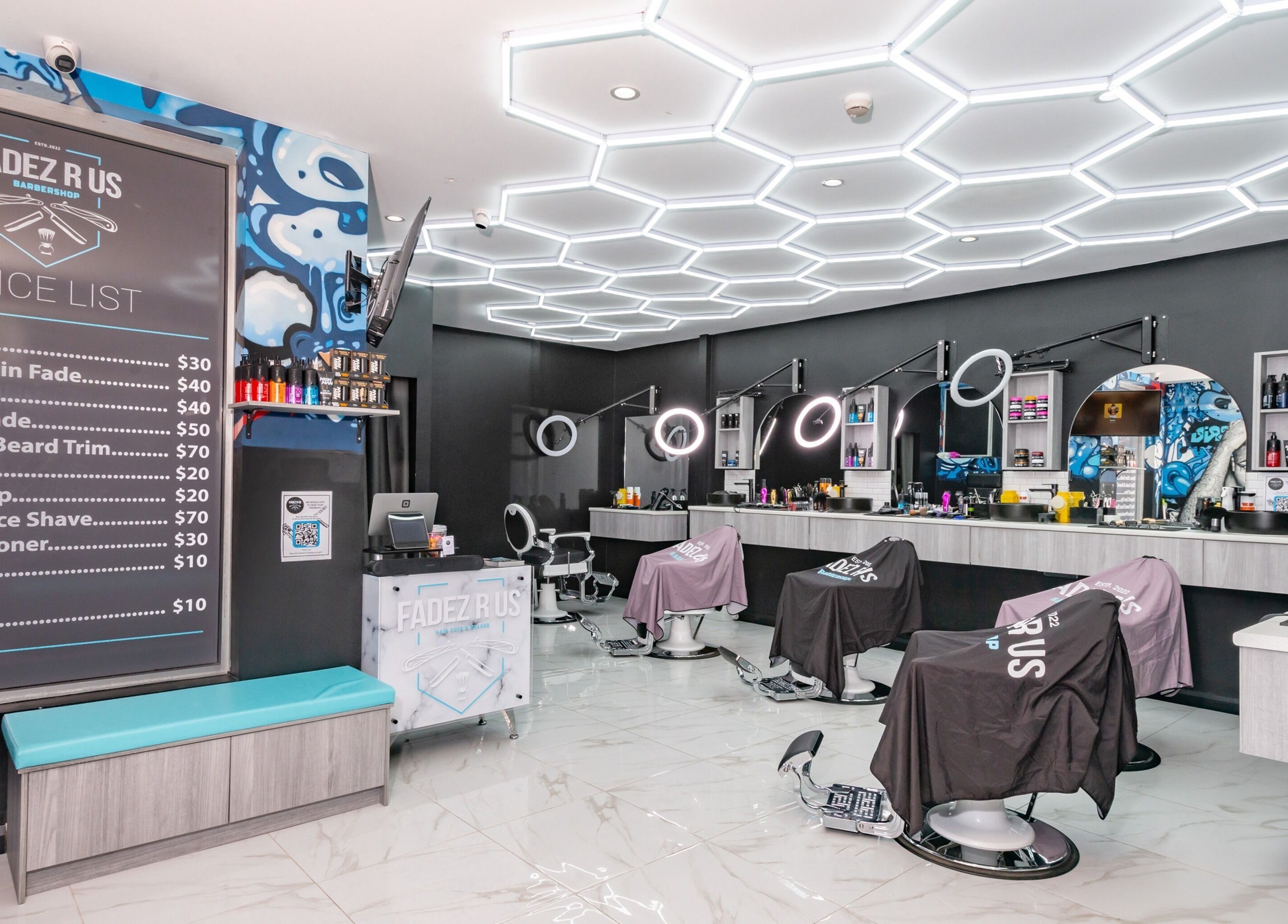 Inside FADEZ R US barbershop in Penrith, NSW, AU showcasing modern barber chairs and price list.