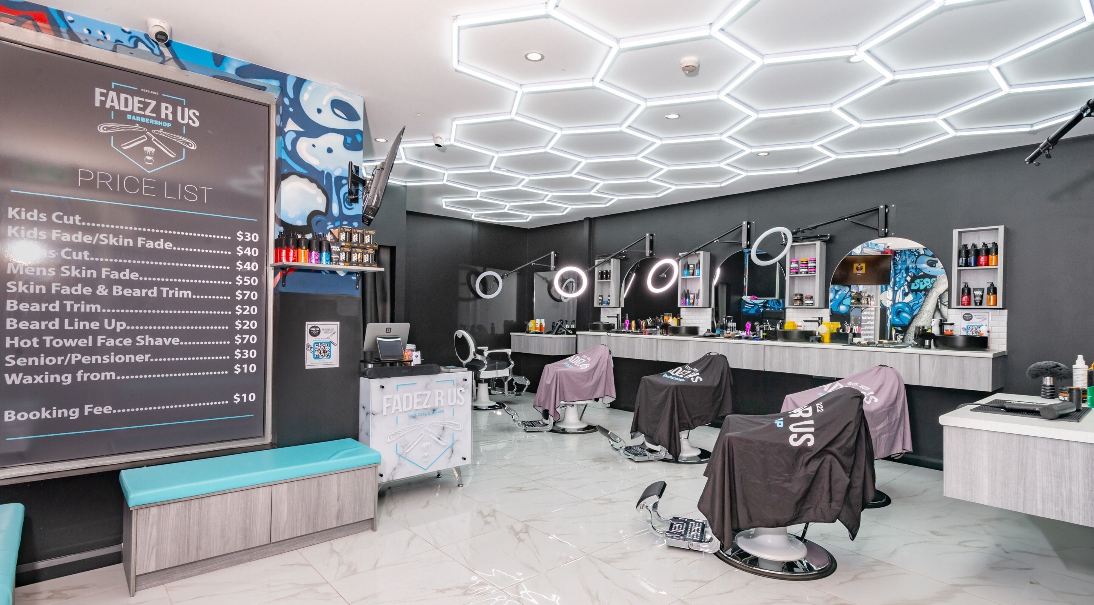 Inside FADEZ R US barbershop in Penrith, NSW, AU showcasing modern barber chairs and price list.