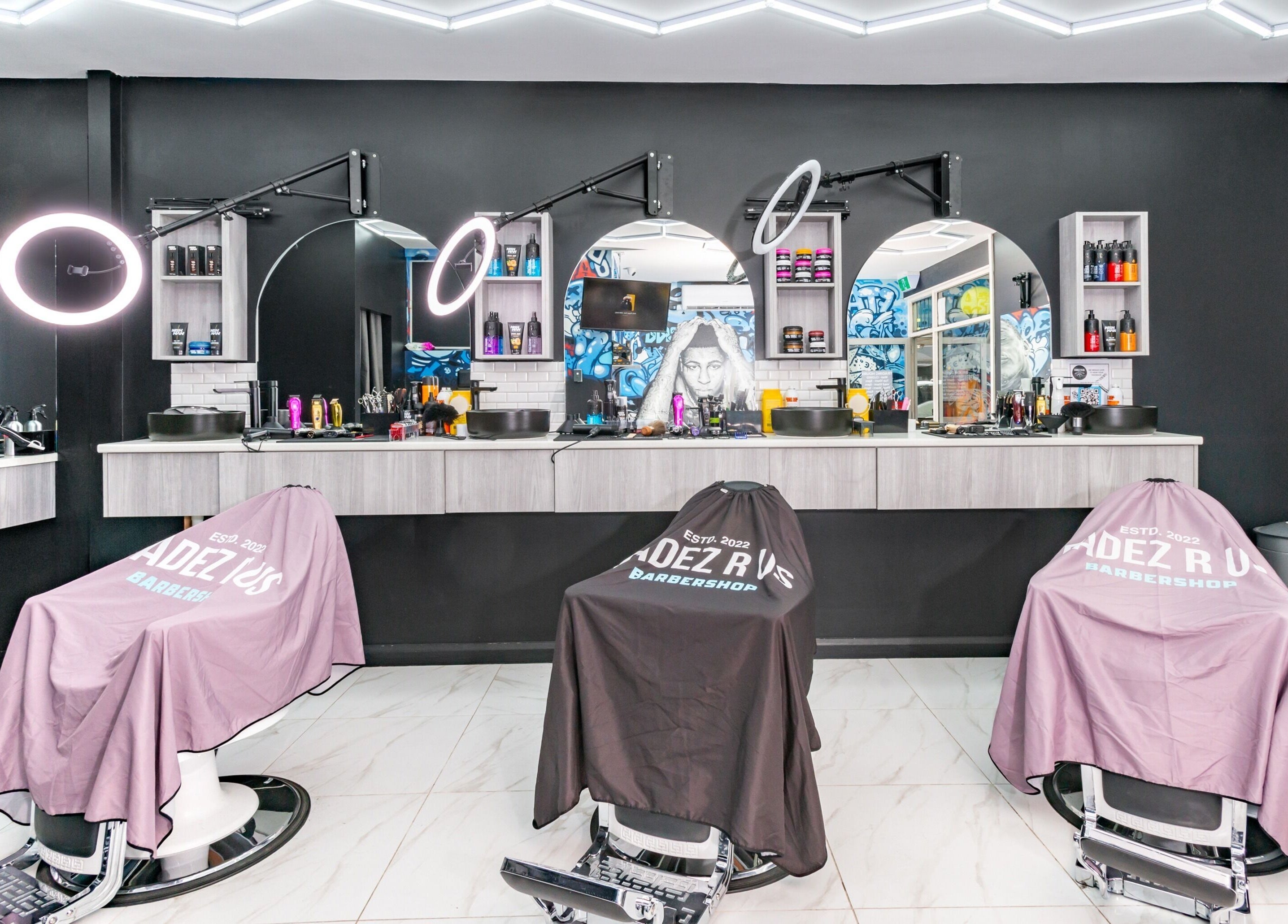 Modern barber chairs and mirrors at FADEZ R US, Penrith, NSW, AU highlighting sleek design.