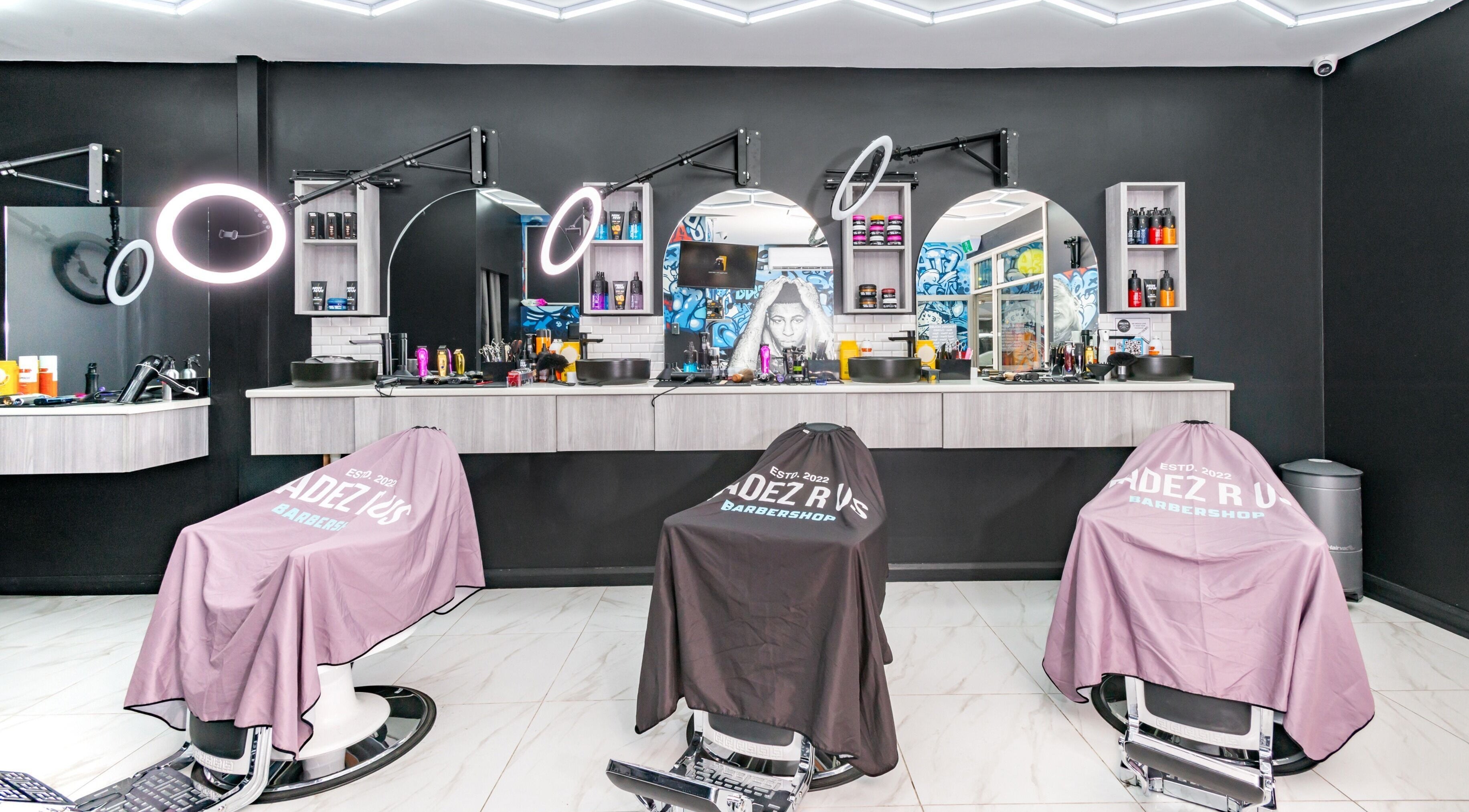 Modern barber chairs and mirrors at FADEZ R US, Penrith, NSW, AU highlighting sleek design.