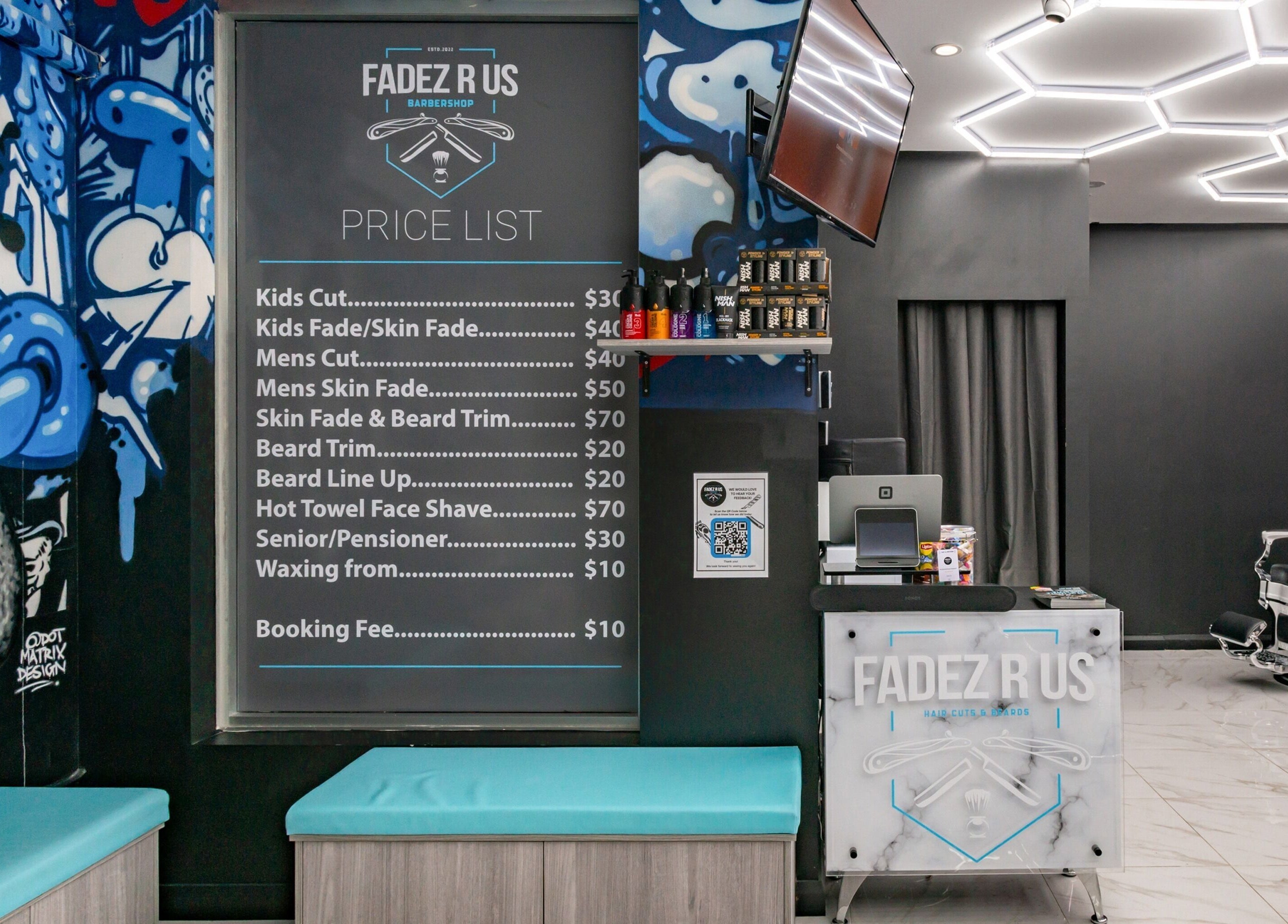 Inside FADEZ R US, Penrith, NSW, AU, showcasing modern decor, price list, and stylish barber chair.