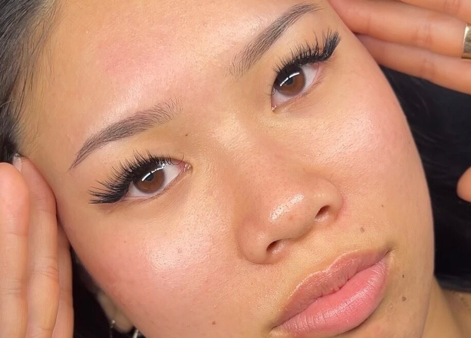 Close-up of glowing skin at CeLuxe Aesthetics, Southport, Queensland, AU. Perfect lashes and smooth complexion.