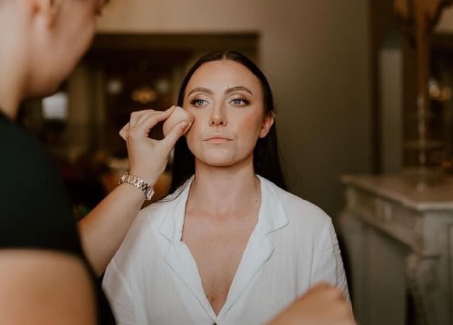 Makeup application at Emma W Beauty, Bristol, England, GB, highlighting skilled detail work in a serene setting.