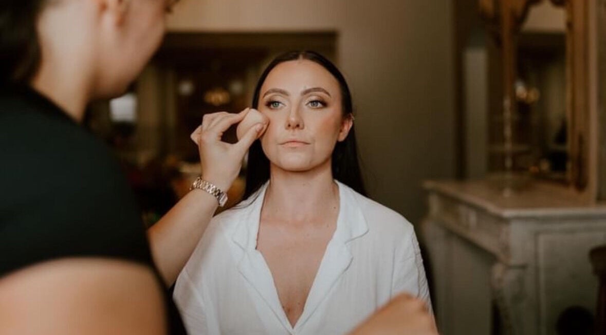 Makeup application at Emma W Beauty, Bristol, England, GB, highlighting skilled detail work in a serene setting.