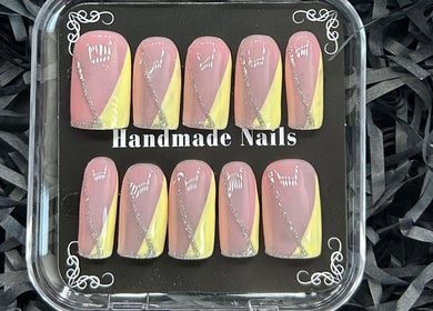 Handmade nail set with pink and yellow designs at Miaedon Beauty Room, Applecross, Western Australia, AU.