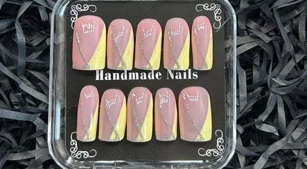 Handmade nail set with pink and yellow designs at Miaedon Beauty Room, Applecross, Western Australia, AU.