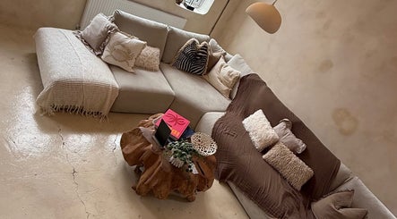 Inviting lounge area in Foxie Skin Clinic @ Mantra Collaborative, Bolton, England, GB with cozy couches and decor.