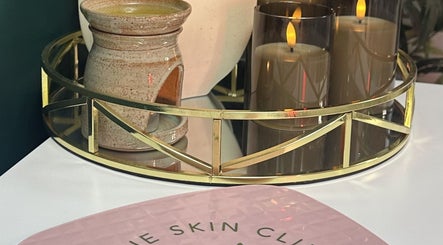 Luxurious candle and decor at Foxie Skin Clinic, Buxton, England, GB, creating a serene and elegant ambiance.