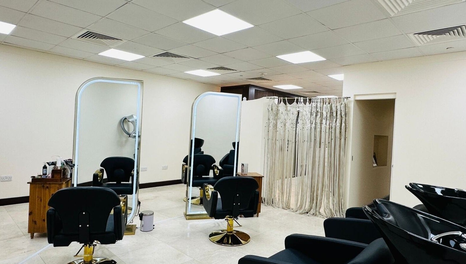 Korea Beauty Salon's chic interior, featuring sleek hair stations in Muscat, Muscat Governorate, OM.
