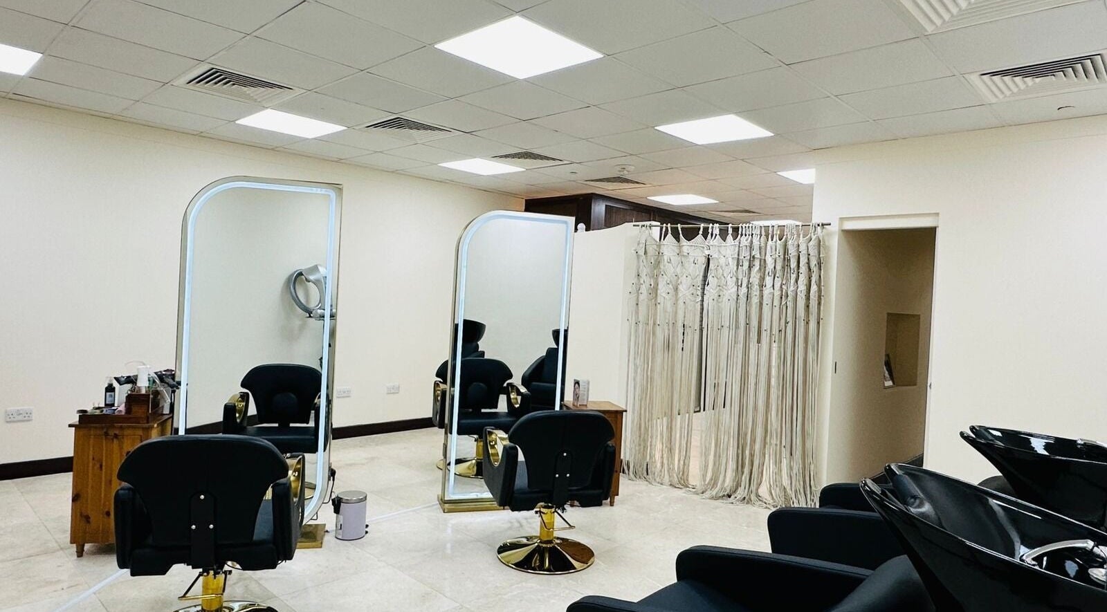 Korea Beauty Salon's chic interior, featuring sleek hair stations in Muscat, Muscat Governorate, OM.