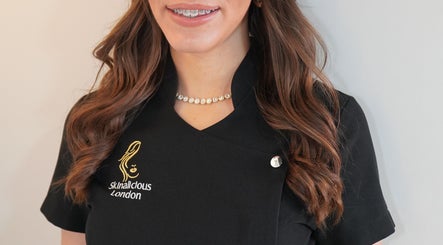 Professional staff at Skinalicious London in Bexley, England, GB, wearing branded uniform and smiling.