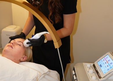 Facial treatment in progress at Skinalicious London, Bexley, England, GB, featuring advanced skincare equipment.