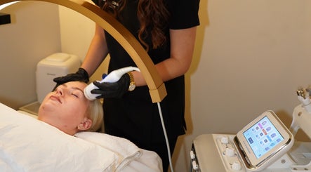 Facial treatment in progress at Skinalicious London, Bexley, England, GB, featuring advanced skincare equipment.