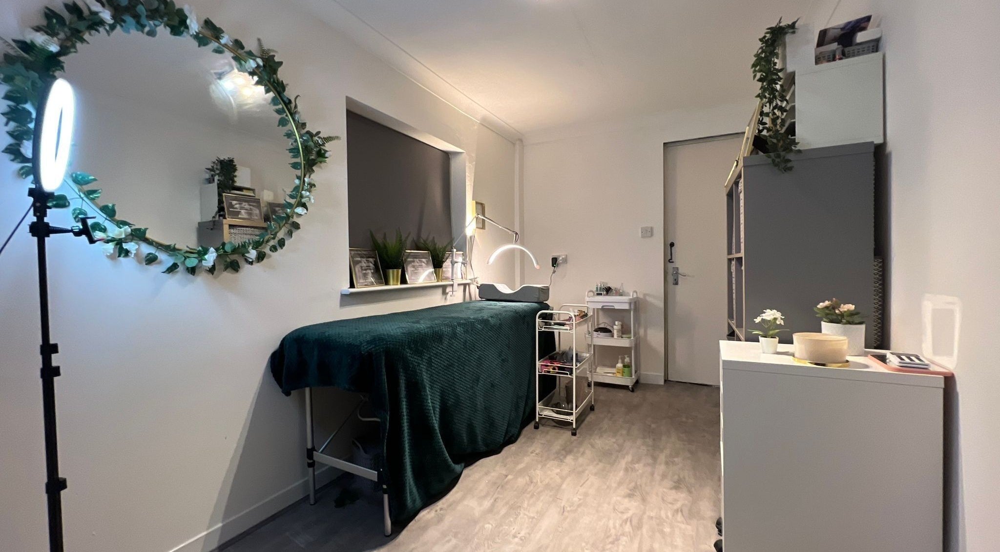 Modern serene beauty room at Flaunt Beauty, Hempstead, England, GB with greenery and ambient lighting.
