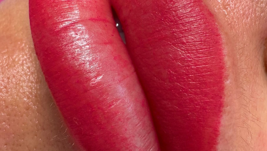 Close-up of vibrant lips tattoo at Andreea CAT PMU & Lash Artist, Dagenham, England, GB.