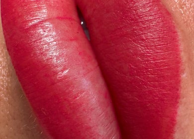 Close-up of vibrant lips tattoo at Andreea CAT PMU & Lash Artist, Dagenham, England, GB.