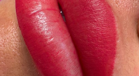 Close-up of vibrant lips tattoo at Andreea CAT PMU & Lash Artist, Dagenham, England, GB.