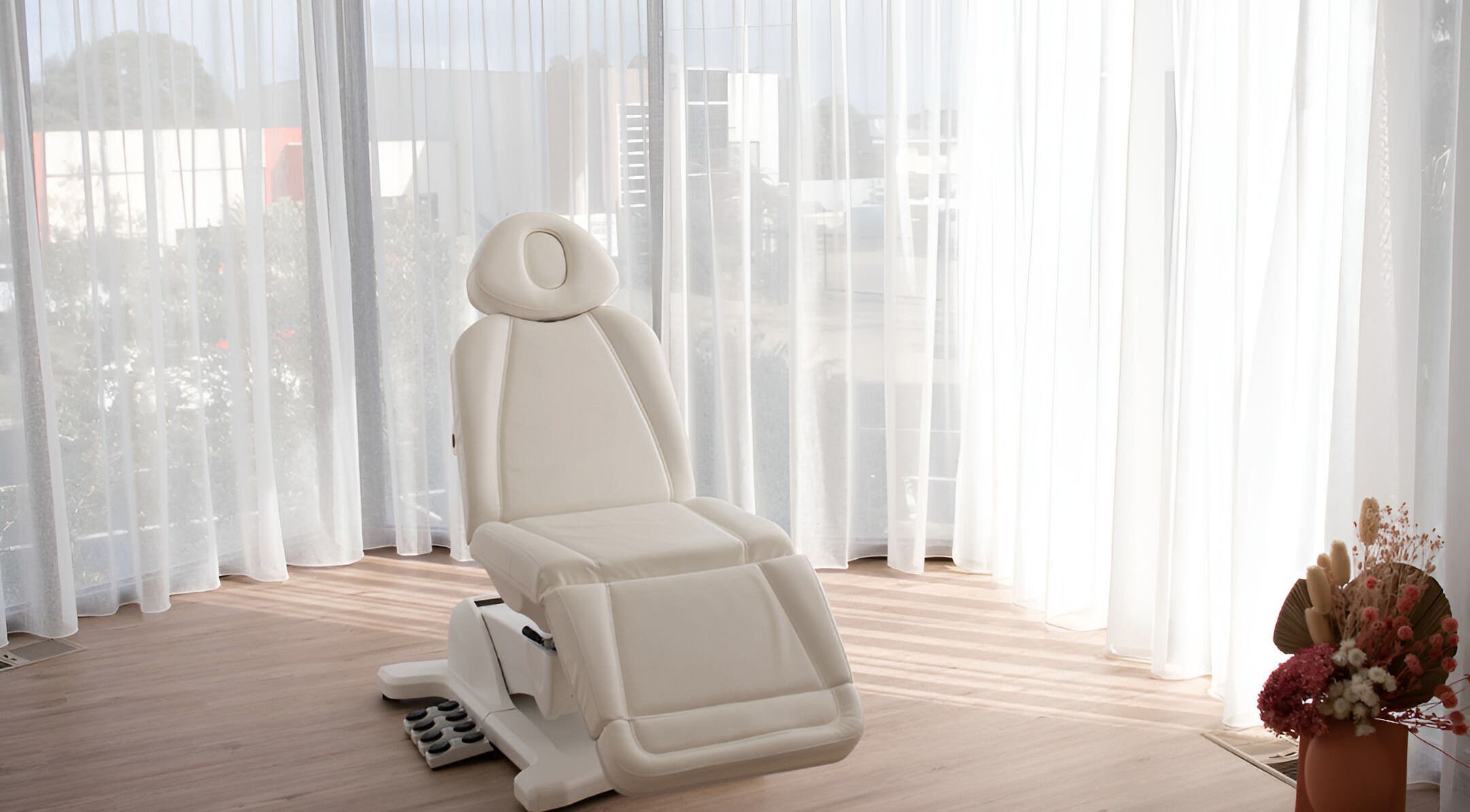 Luxurious treatment chair at Your Aesthetic, Berwick, VIC, AU with natural light and elegant decor.