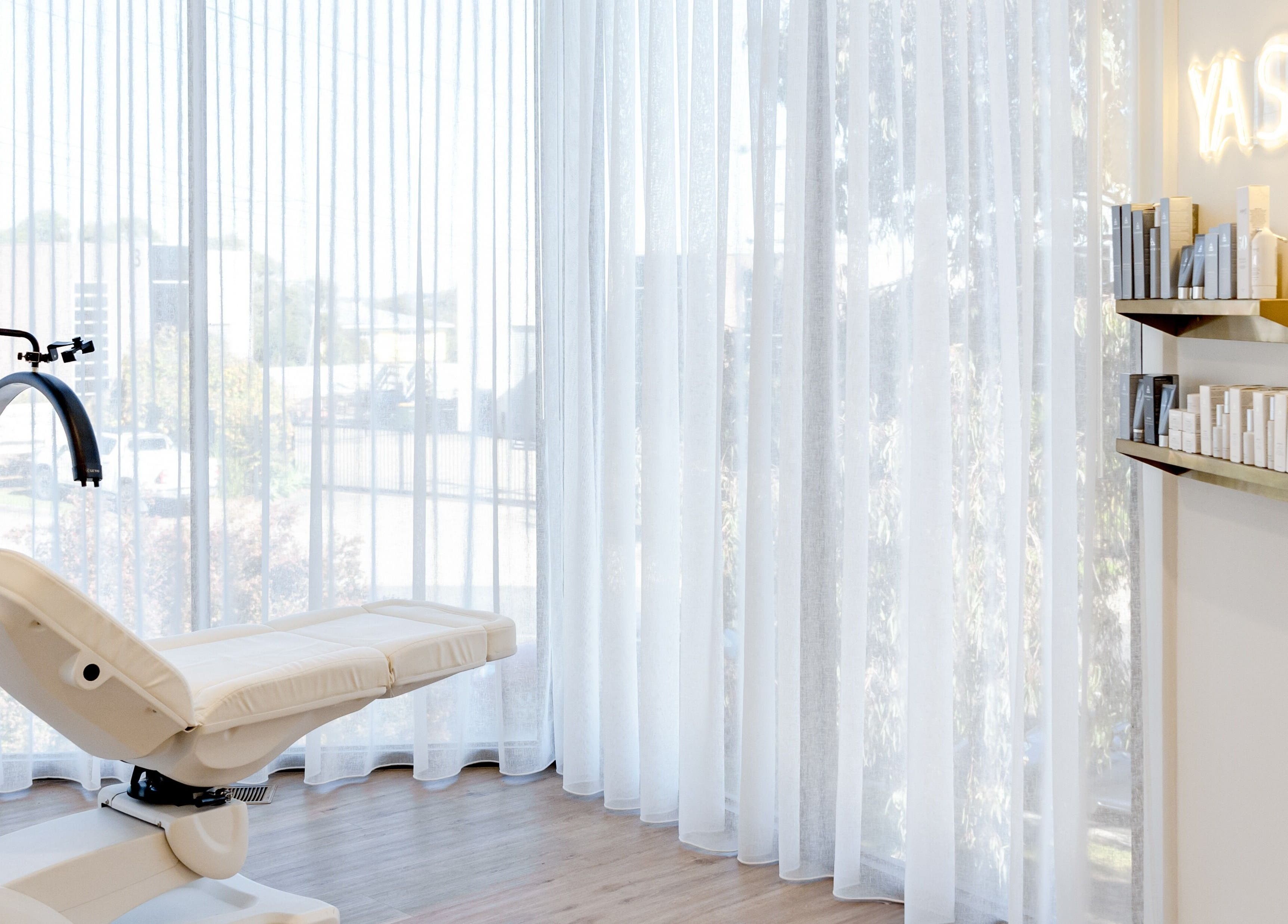 Luxurious treatment chair at Your Aesthetic, Berwick, VIC, AU, with natural light and skincare products.