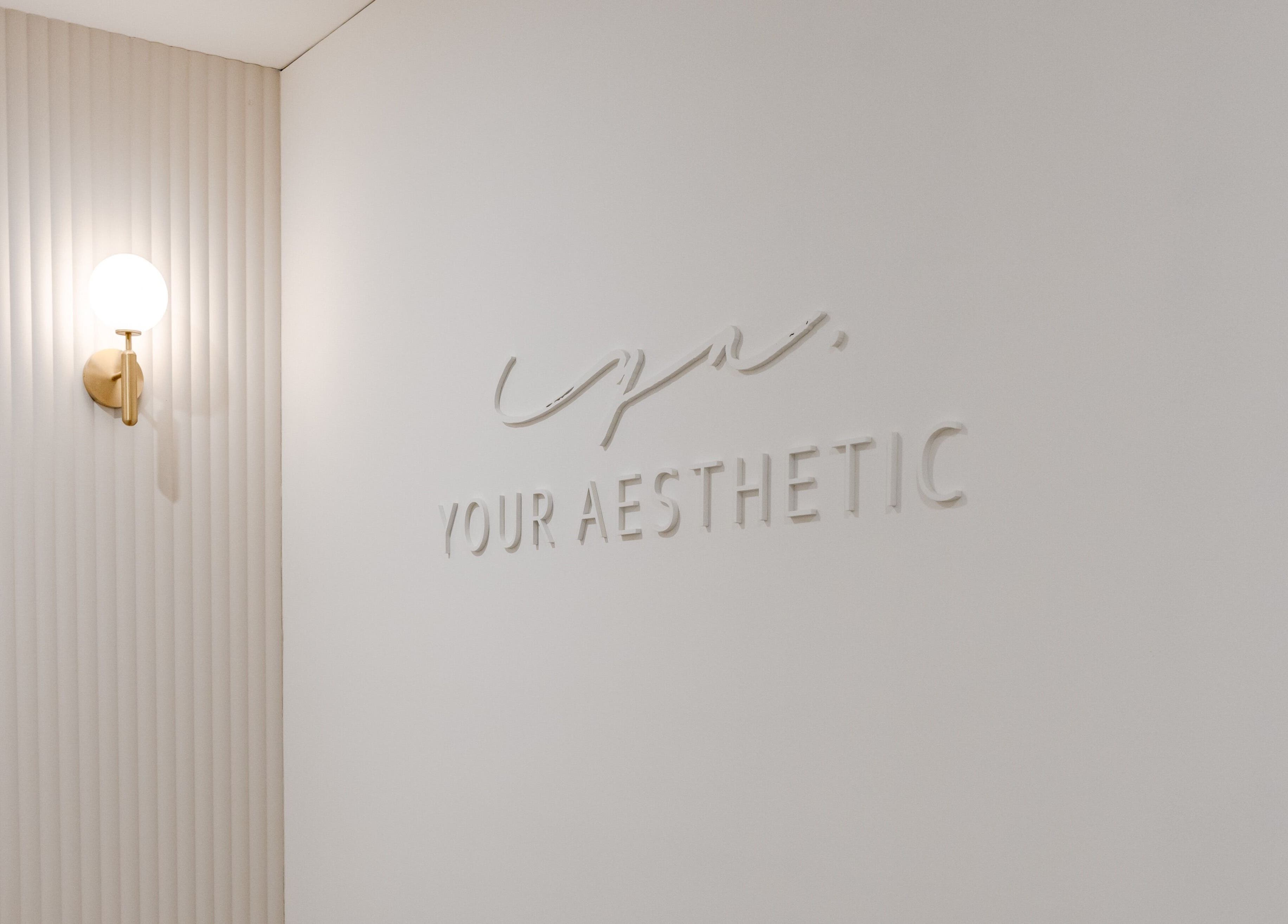 Elegant Your Aesthetic wall design in Berwick, VIC, AU with modern light fixture.