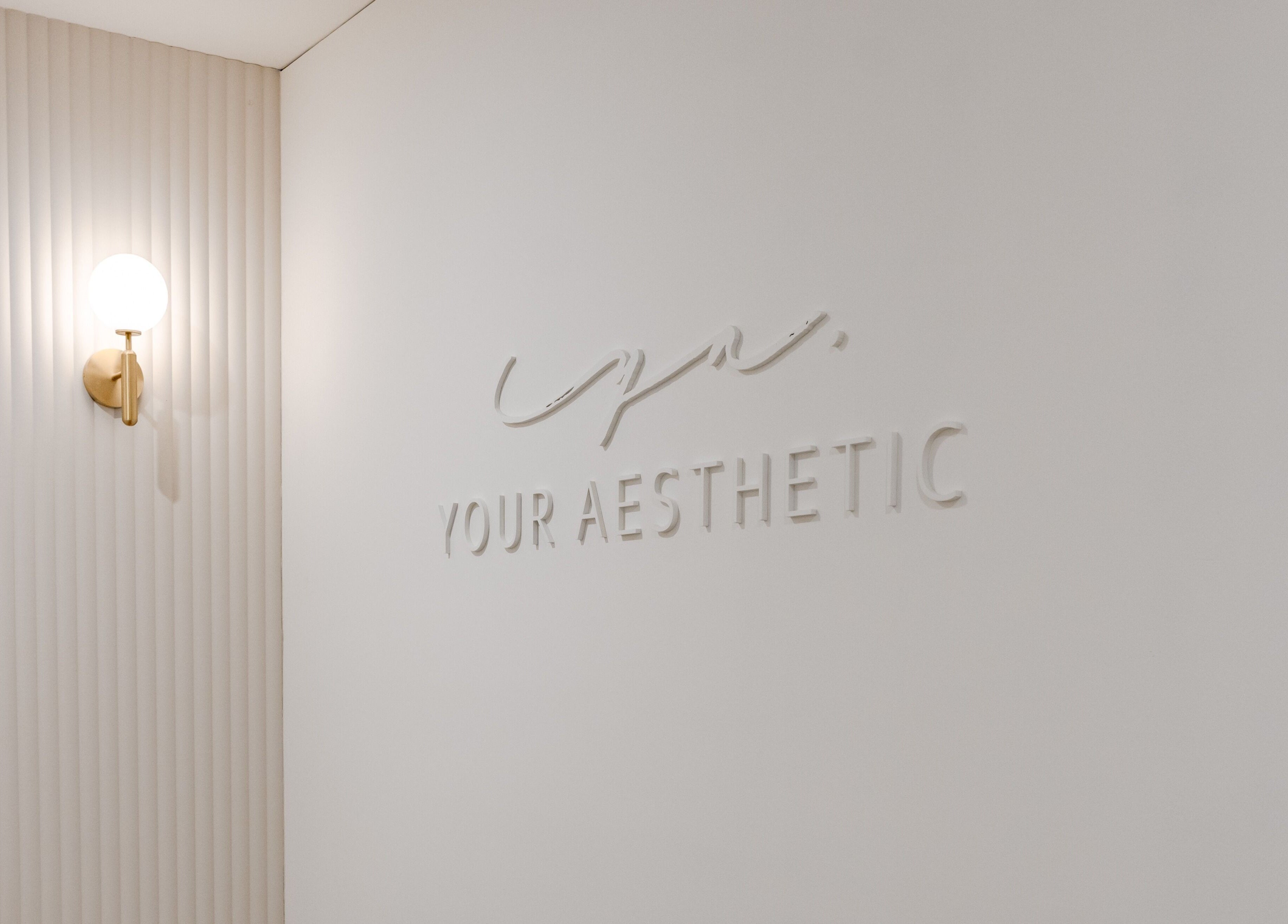 Elegant Your Aesthetic wall design in Berwick, VIC, AU with modern light fixture.