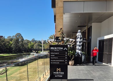 Exterior view near The Slimming Lounge in Parramatta, New South Wales, AU, showing clear skies and lush greenery.