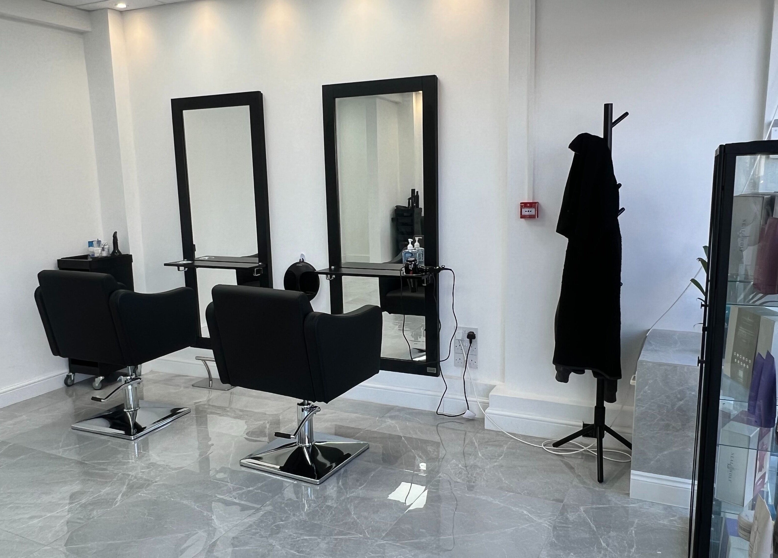 Modern salon interior at V Blush, with sleek chairs and mirrors in London, England, GB.