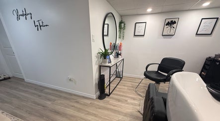 Chic salon interior at Hairstyling by Taitum, Renfrew, Ontario, CA featuring stylish decor and modern furnishings.