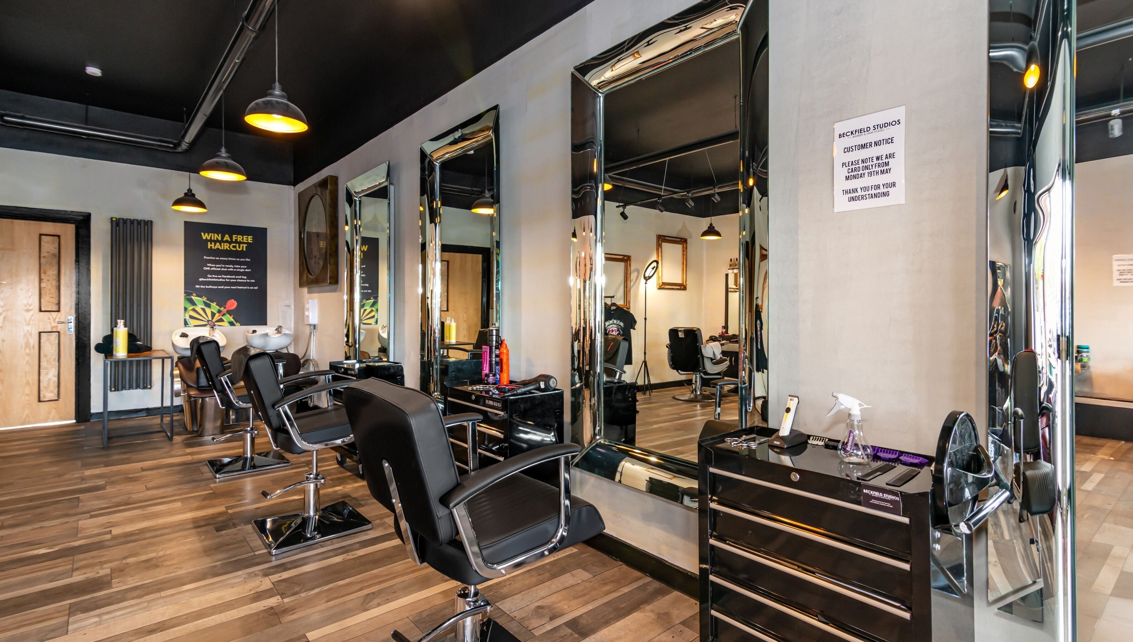 Modern salon interior at Beckfield Studios, Thornaby, England, GB with stylish mirrors and chairs.
