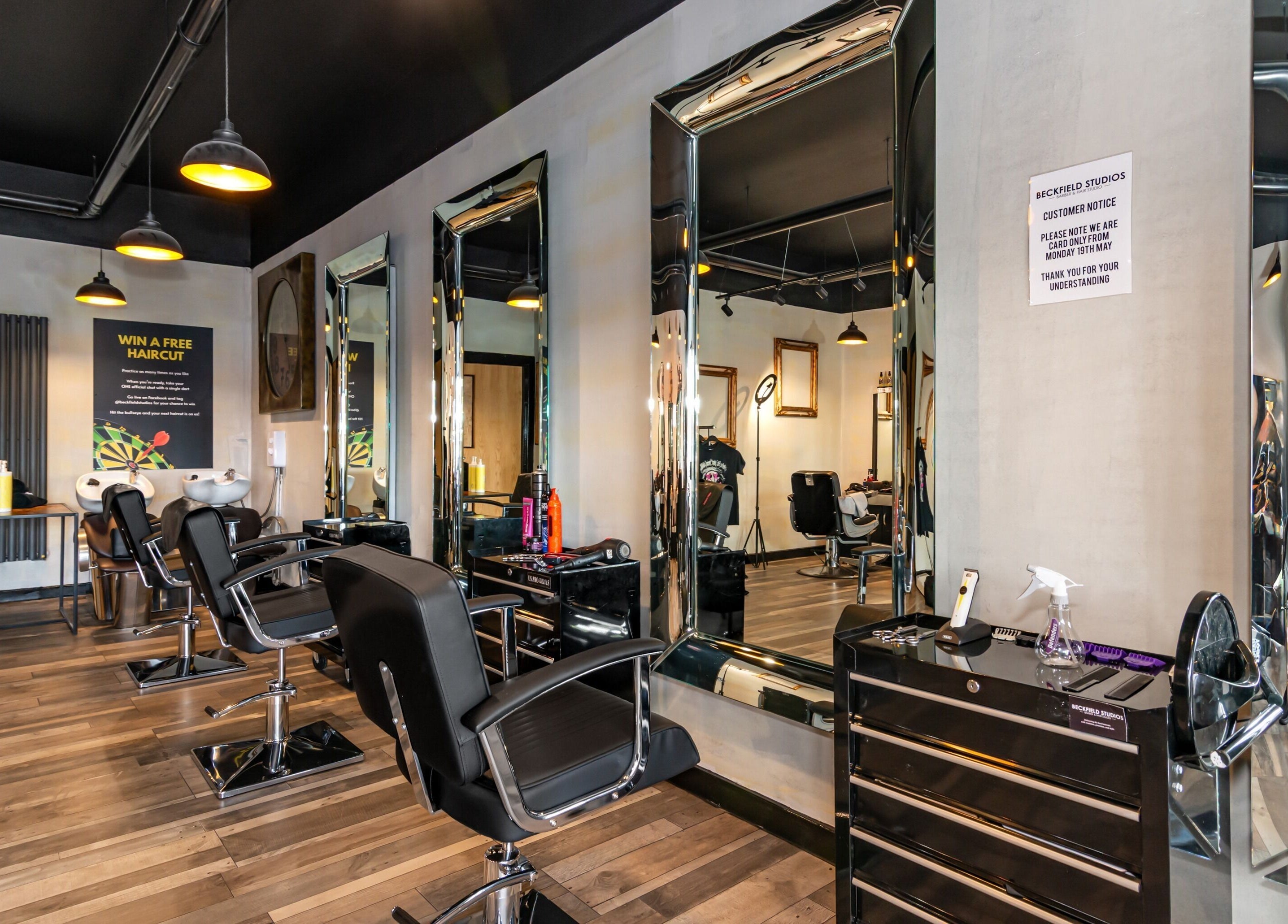 Modern salon interior at Beckfield Studios, Thornaby, England, GB with stylish mirrors and chairs.