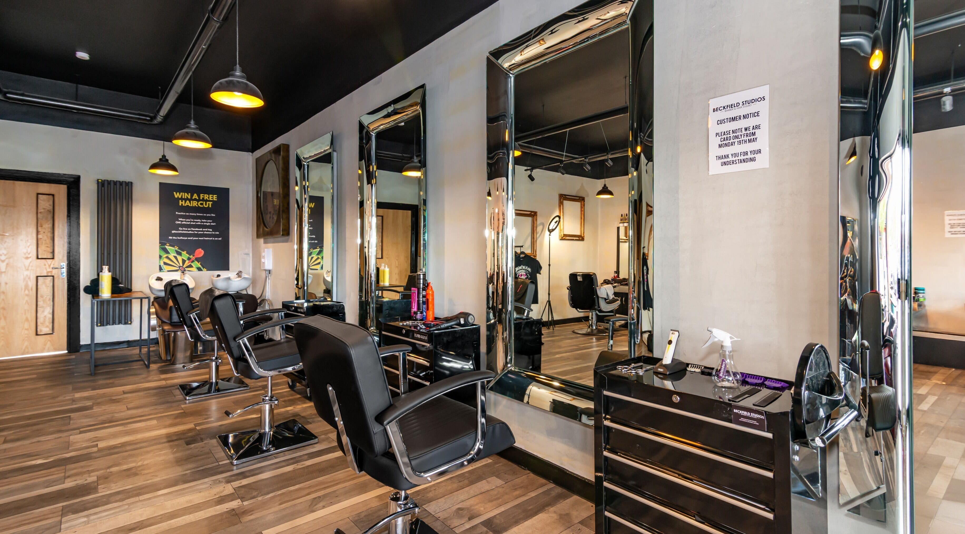 Modern salon interior at Beckfield Studios, Thornaby, England, GB with stylish mirrors and chairs.
