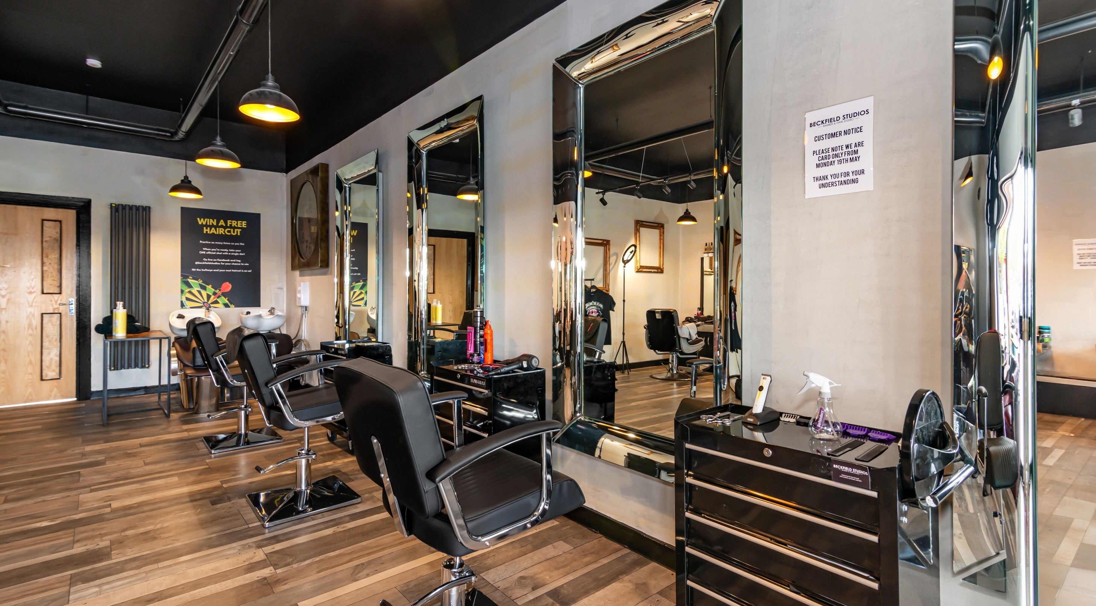 Modern salon interior at Beckfield Studios, Thornaby, England, GB with stylish mirrors and chairs.